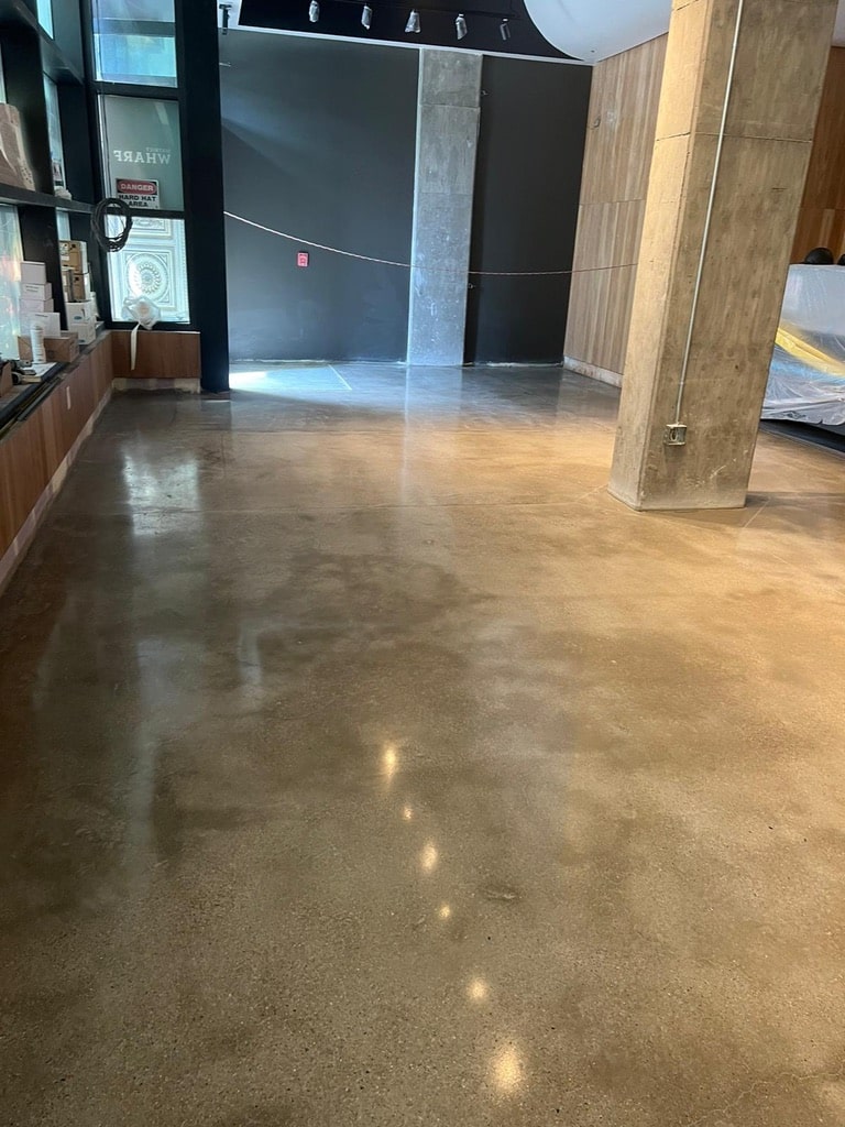 High-gloss polished concrete floor with wood accents in Richmond.