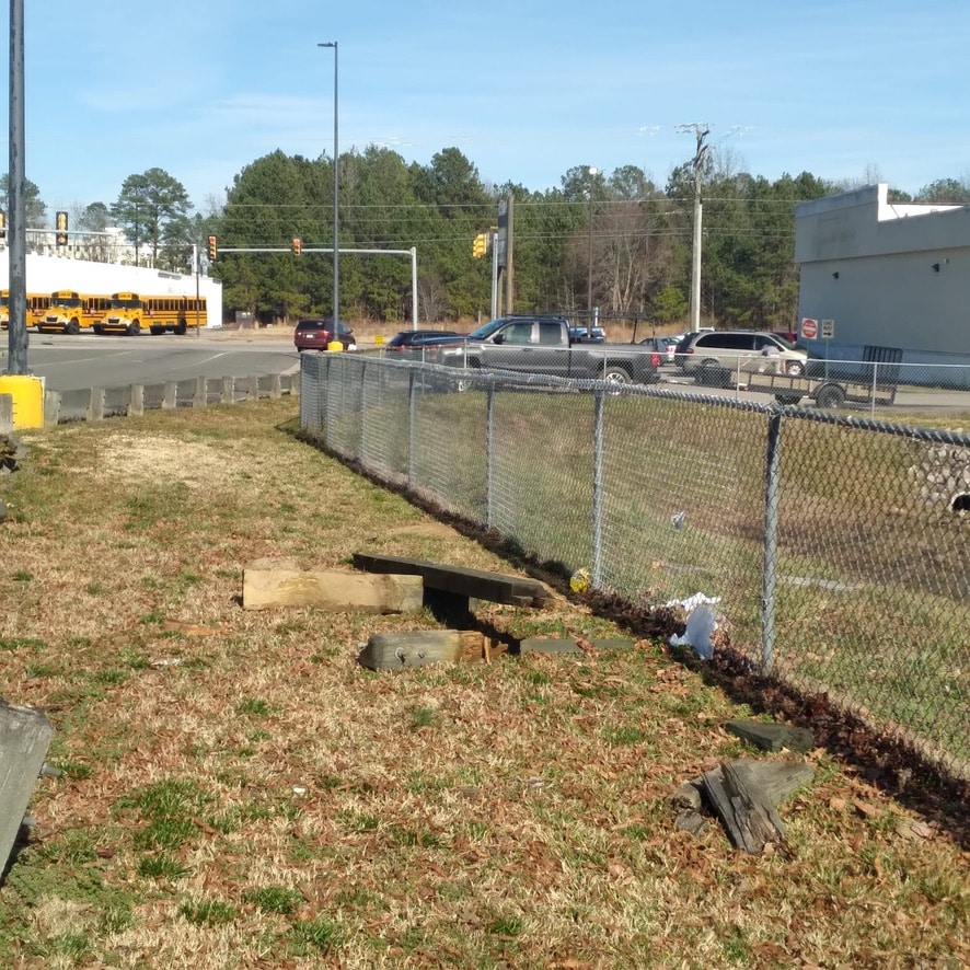 Galvanized chain link fence along roadside in Bensley.